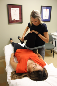 Physiotherapy treatment performing adjustment on patient